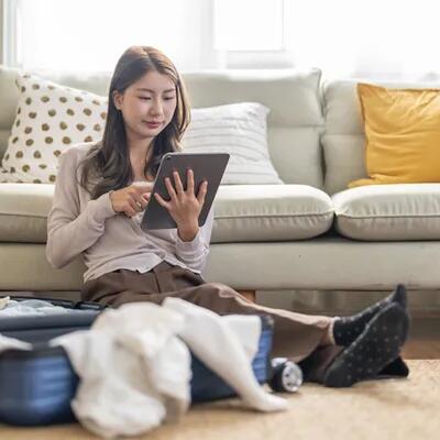 woman booking travel packing